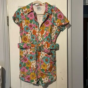Show Me Your MuMu Outlaw floral romper with matching belt.